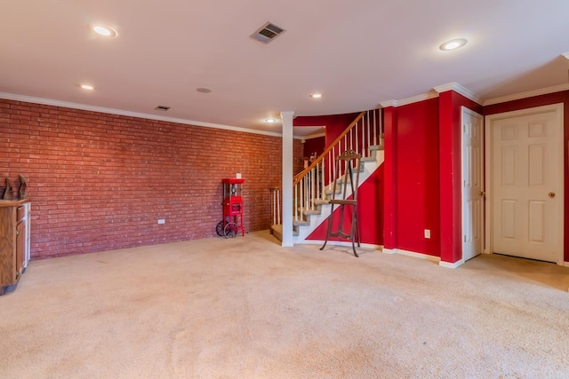 interior space featuring brick wall, light carpet, and ornamental molding