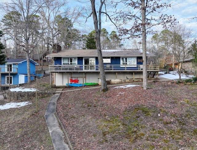 view of front of house with a wooden deck