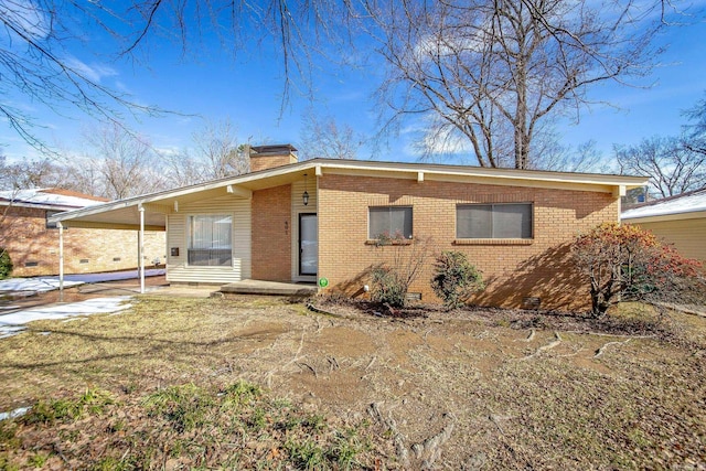 view of front of home with a carport