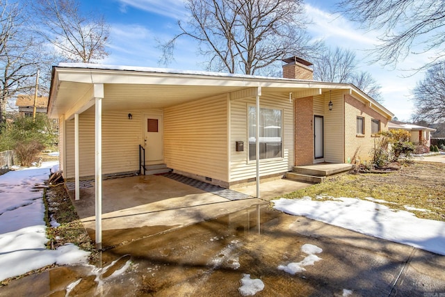 view of front facade with a carport