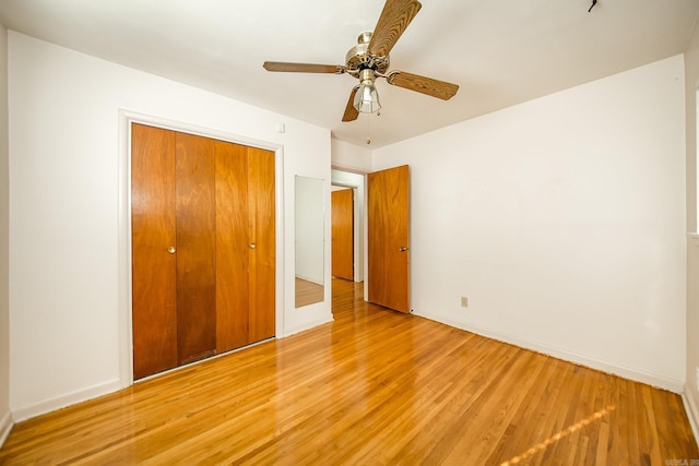 unfurnished bedroom with a closet, ceiling fan, and light hardwood / wood-style floors