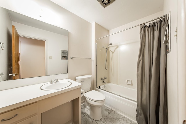 full bathroom with vanity, shower / bath combo with shower curtain, and toilet