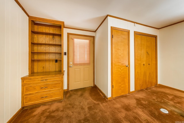 interior space with crown molding and dark colored carpet