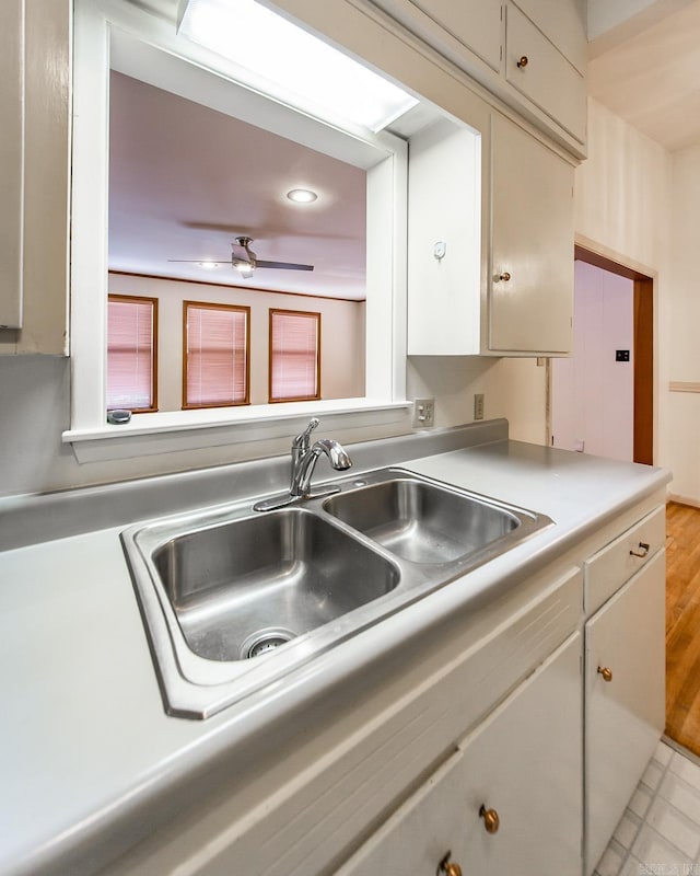 kitchen with ceiling fan and sink