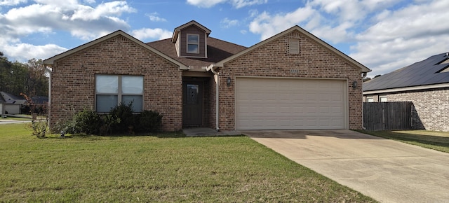 view of front of property featuring a garage and a front yard