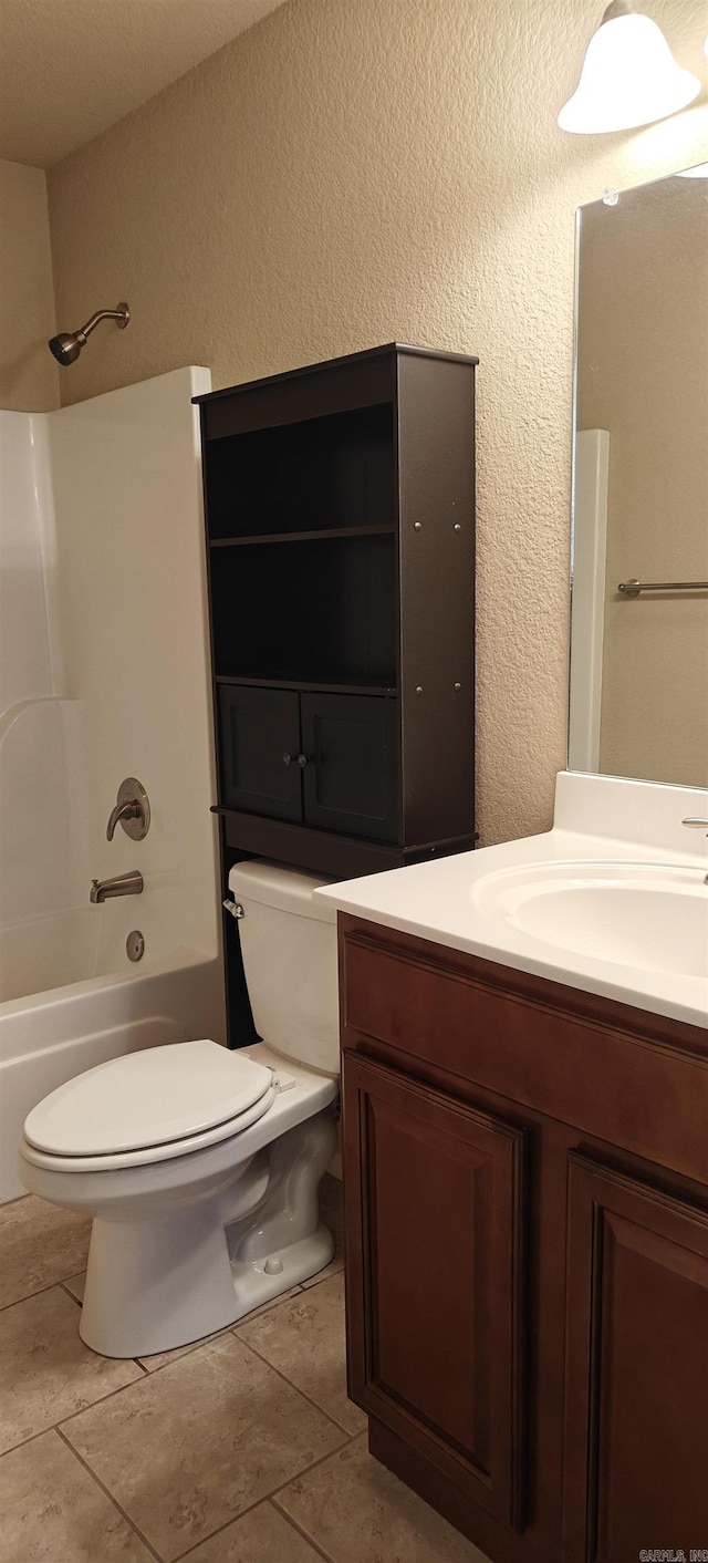 full bathroom featuring vanity, washtub / shower combination, and toilet