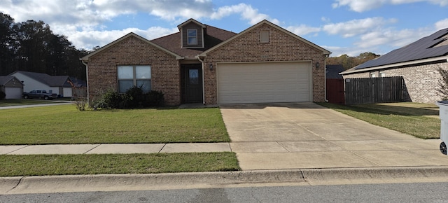 front facade with a front yard and a garage