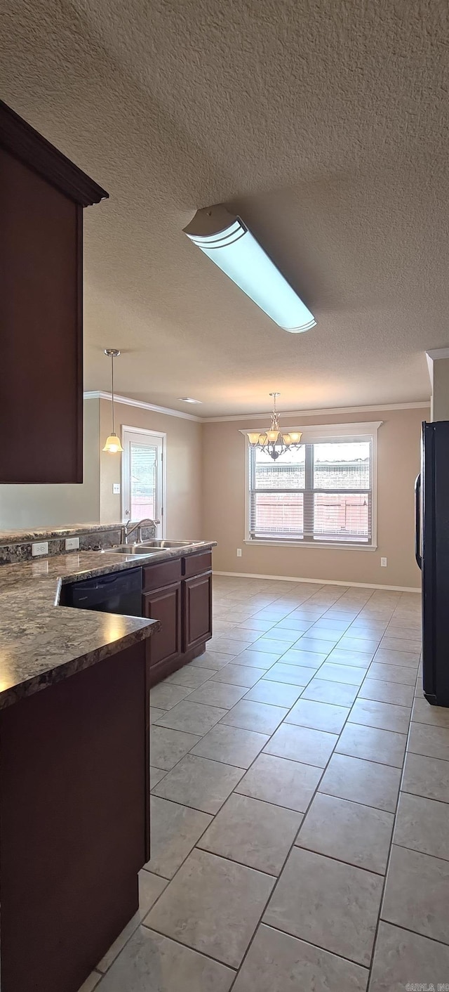 kitchen featuring hanging light fixtures, a notable chandelier, light tile patterned floors, black appliances, and dark brown cabinets