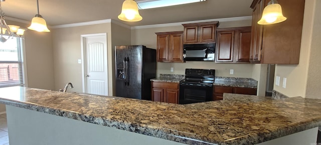 kitchen with sink, decorative light fixtures, ornamental molding, and black appliances