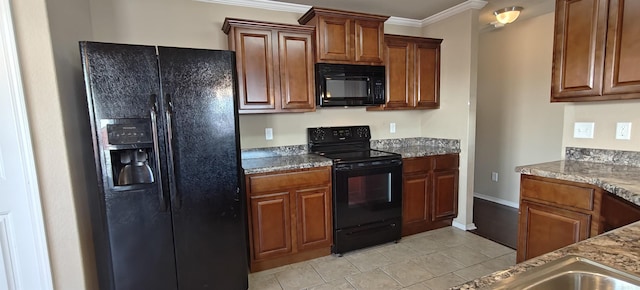 kitchen featuring crown molding, stone counters, light tile patterned flooring, and black appliances