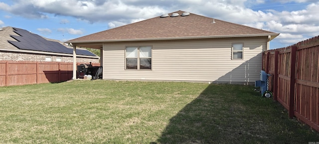 rear view of house with a yard