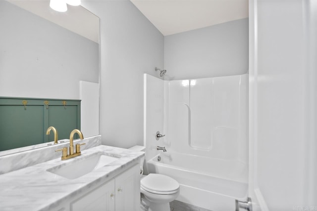 full bathroom with toilet, vanity, and washtub / shower combination