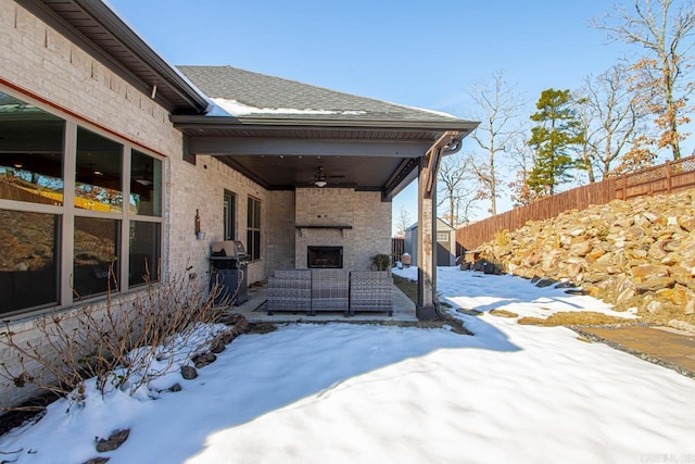 exterior space featuring ceiling fan and area for grilling