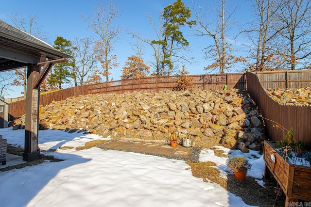 view of yard layered in snow