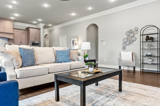 living room with hardwood / wood-style floors and crown molding