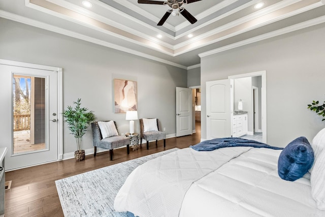 bedroom with ceiling fan, dark hardwood / wood-style flooring, ornamental molding, a tray ceiling, and access to outside