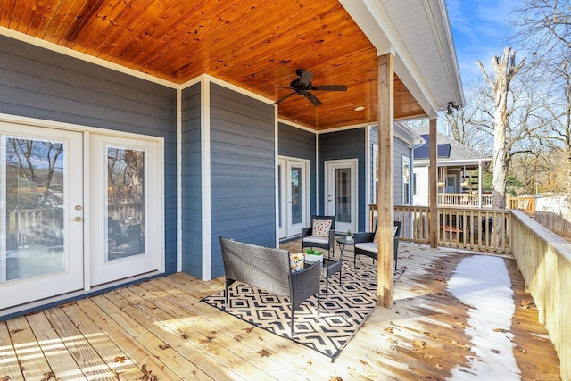 deck featuring ceiling fan and outdoor lounge area