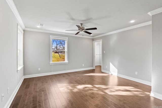 spare room featuring ceiling fan, crown molding, and wood-type flooring