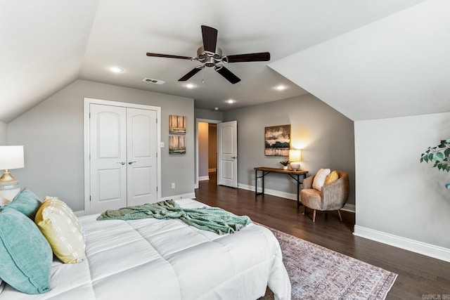 bedroom featuring lofted ceiling, a closet, ceiling fan, and dark wood-type flooring