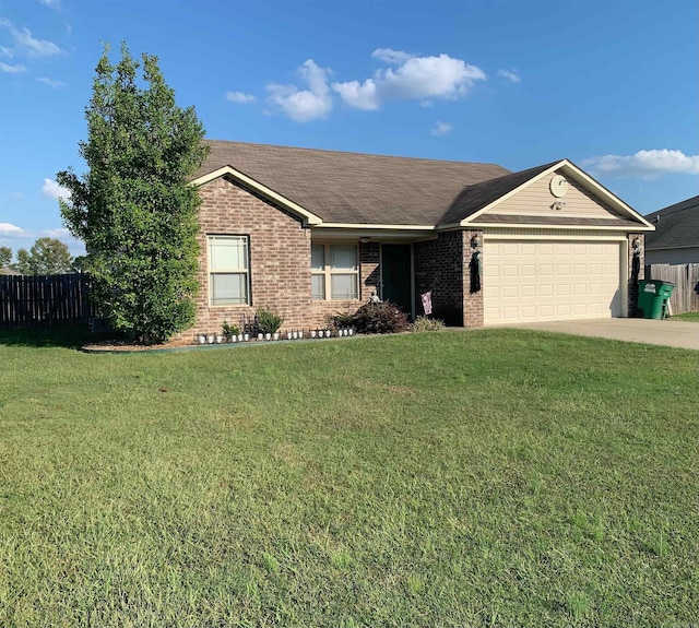 ranch-style home with a front yard and a garage