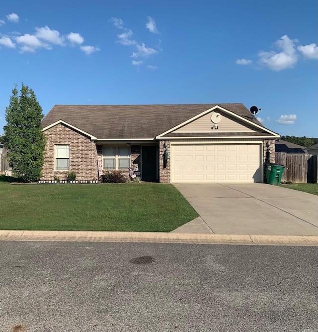 ranch-style house featuring a front lawn and a garage