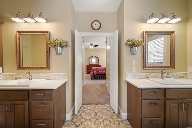 bathroom featuring ceiling fan, vanity, and backsplash