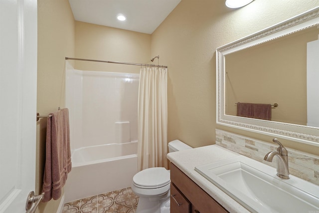 full bathroom with shower / bath combo, vanity, and toilet