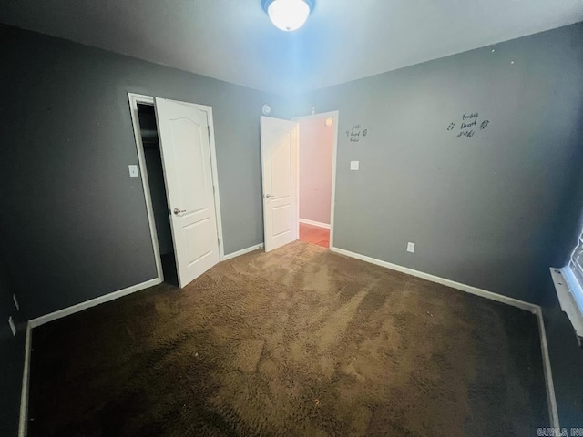 unfurnished bedroom with carpet flooring