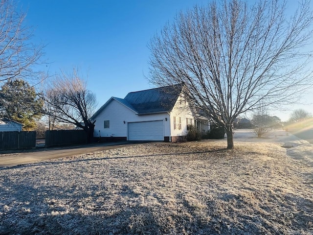 view of property exterior with a garage