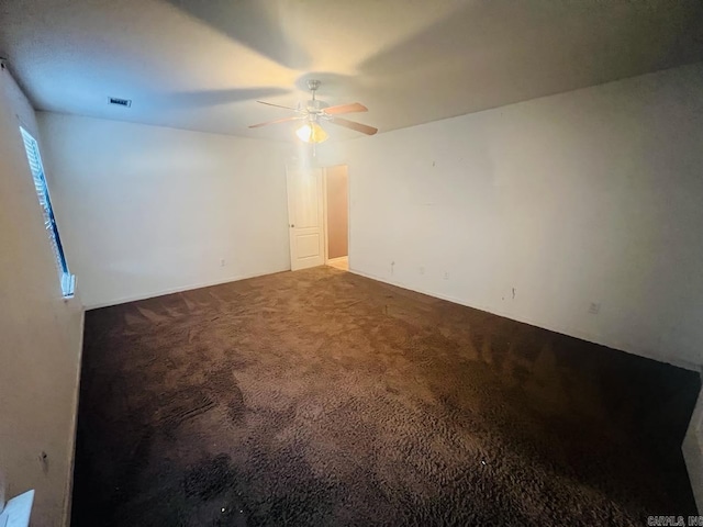 carpeted empty room with ceiling fan