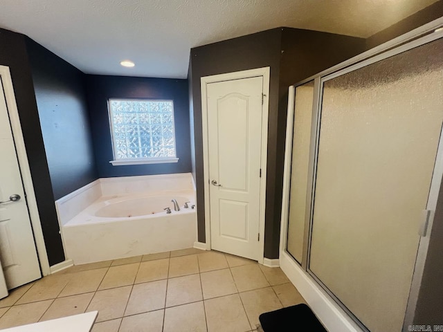 bathroom featuring tile patterned flooring and plus walk in shower