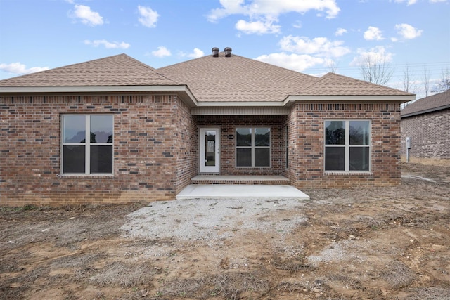 rear view of property featuring a patio