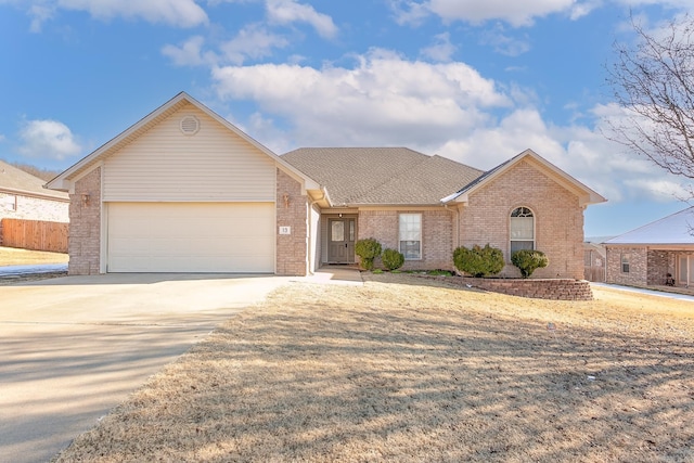 ranch-style home featuring a garage