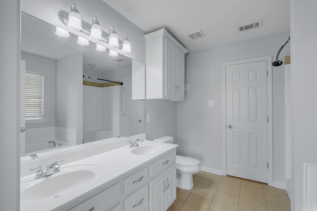 full bathroom featuring toilet, vanity, tile patterned floors, and independent shower and bath