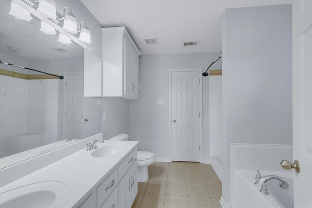 bathroom with toilet, tile patterned flooring, a bathtub, and vanity