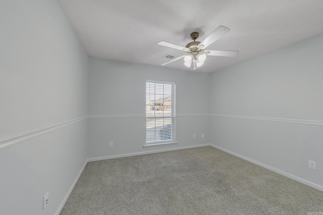 unfurnished room with ceiling fan and carpet flooring