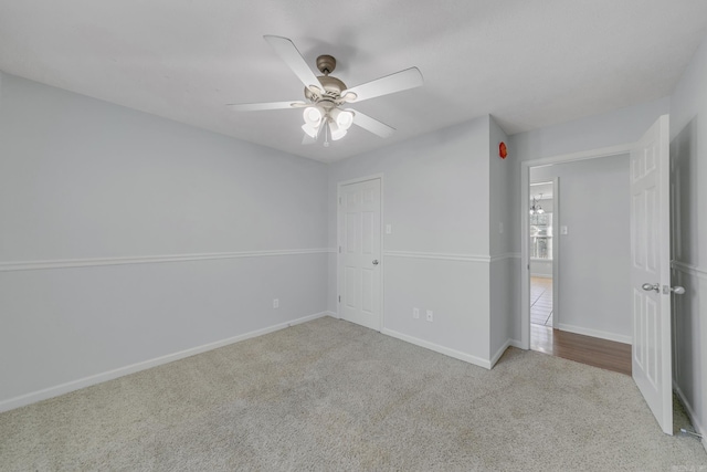 unfurnished bedroom with ceiling fan and light carpet