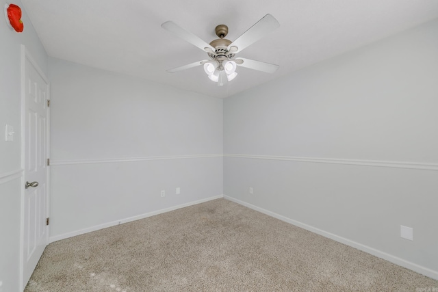 carpeted empty room with ceiling fan