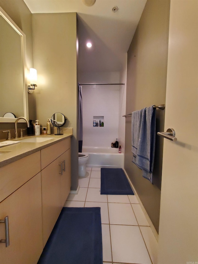 bathroom with vanity, tile patterned floors, and toilet