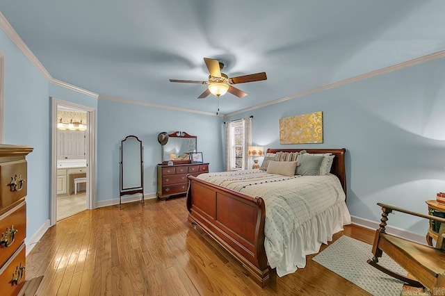 bedroom featuring ensuite bath, ceiling fan, light wood-type flooring, and crown molding