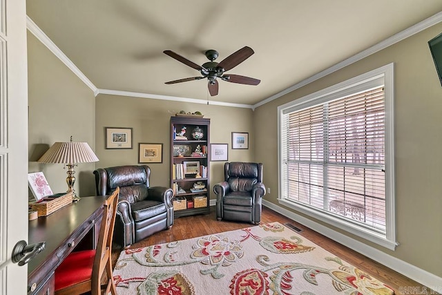 sitting room with ceiling fan, hardwood / wood-style floors, and crown molding