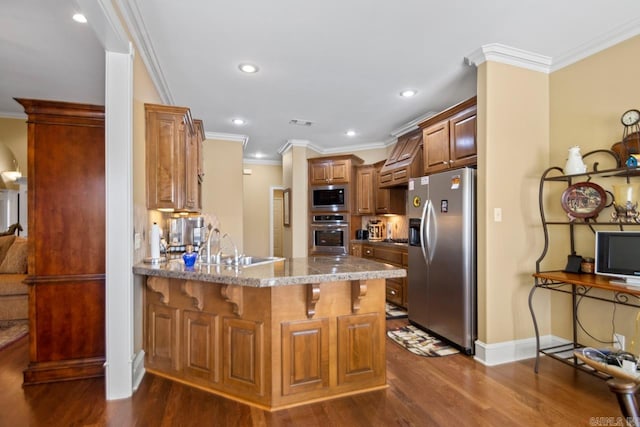 kitchen featuring kitchen peninsula, appliances with stainless steel finishes, crown molding, and dark hardwood / wood-style floors