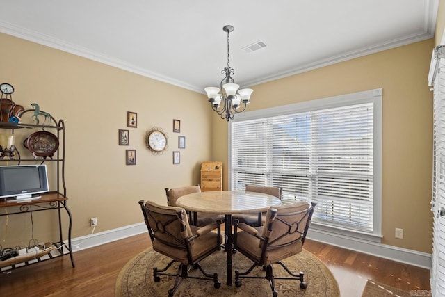 dining area with crown molding, a wealth of natural light, and dark hardwood / wood-style floors