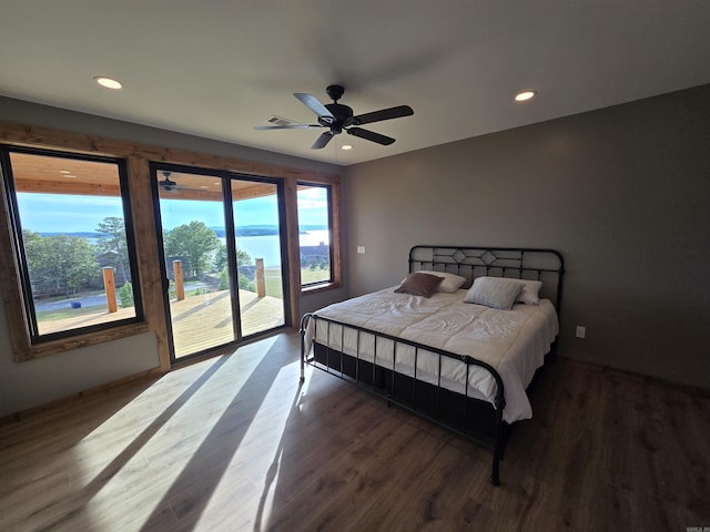 bedroom featuring dark wood-type flooring, ceiling fan, and access to exterior