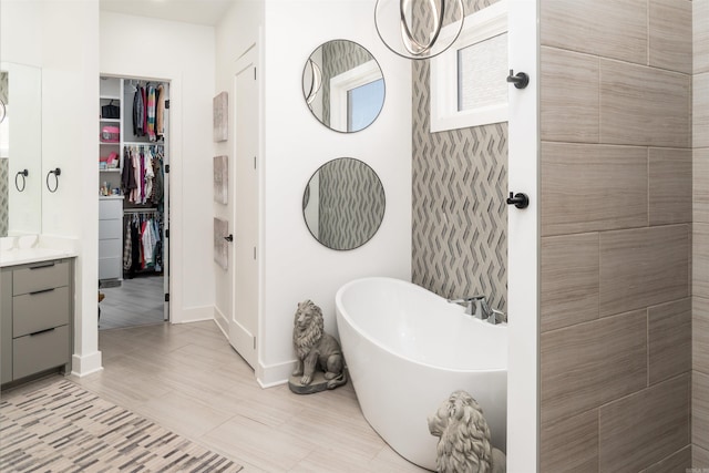 bathroom featuring vanity and a bathing tub