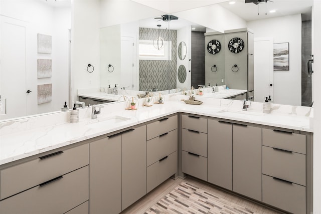 bathroom with a shower and vanity