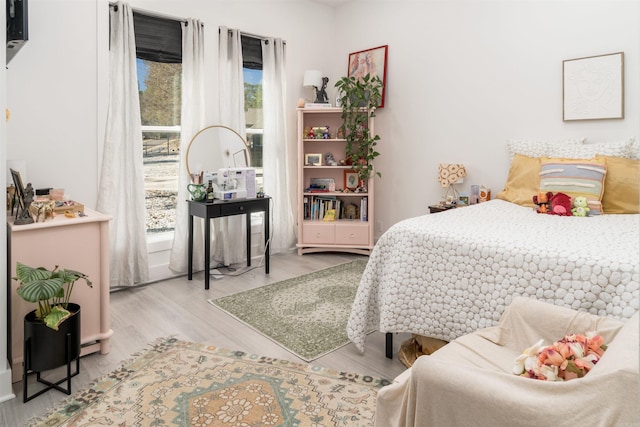 bedroom with light hardwood / wood-style flooring