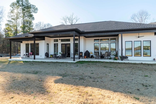 rear view of house with a lawn, ceiling fan, and a patio