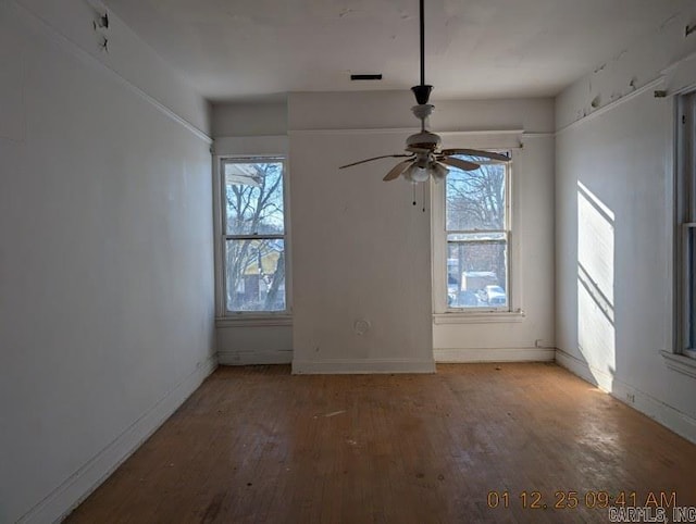 empty room with wood-type flooring and ceiling fan