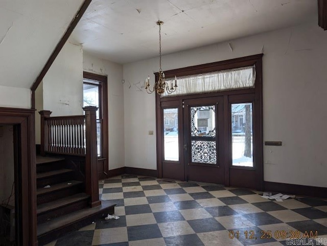 entryway featuring a notable chandelier